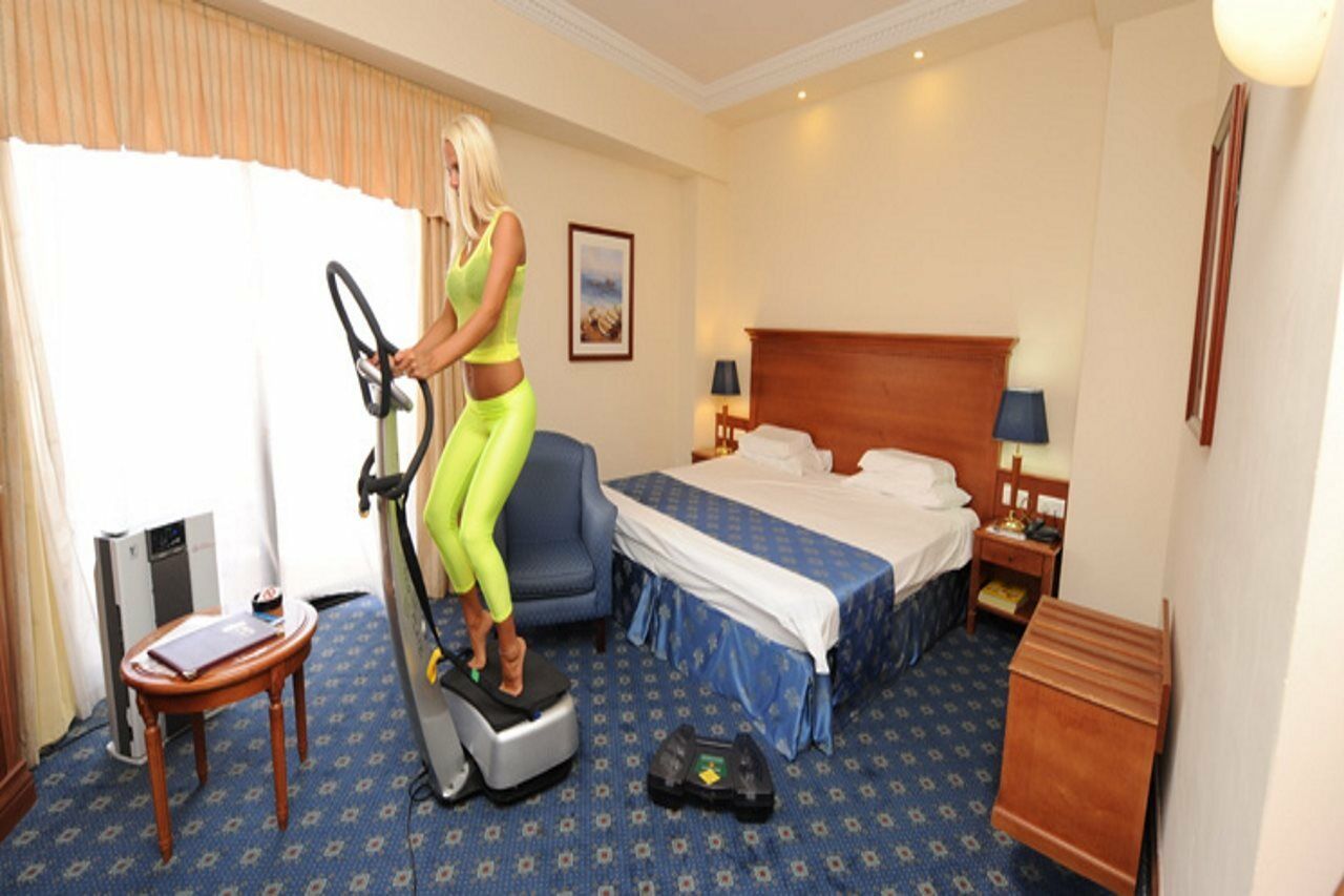 Fortina Spa Resort Sliema Exterior photo A woman on an elliptical trainer